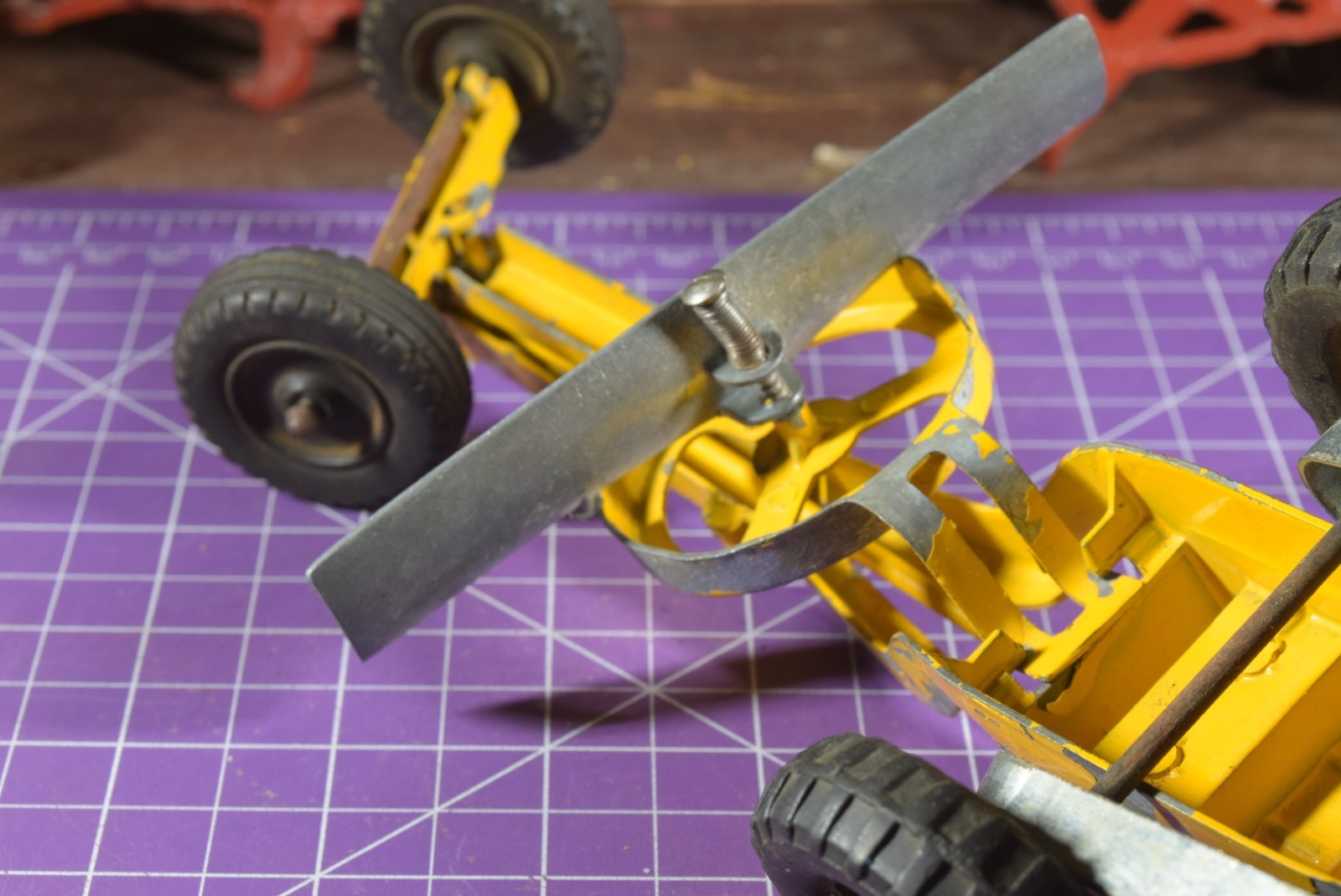 Hubley yellow grader, blade moves but re-engineered at swivel point has issues
