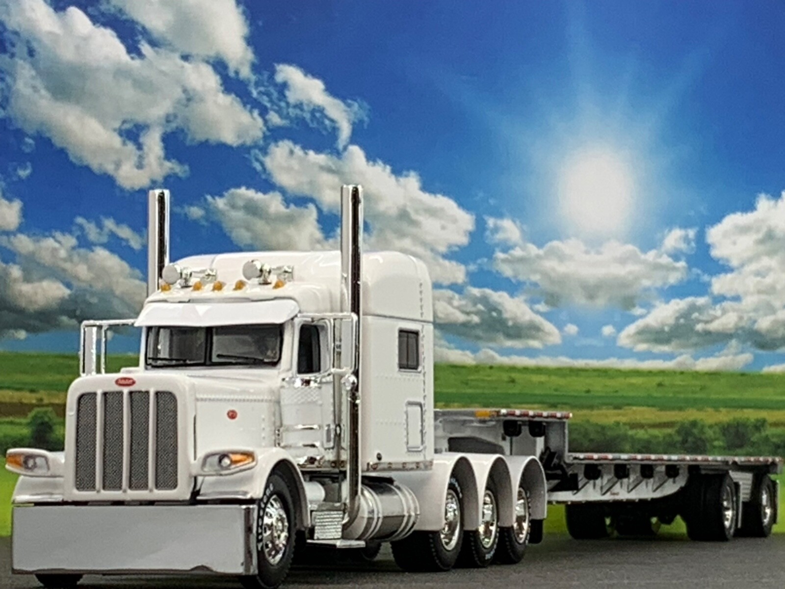 1/64 DCP PETERBILT 389 TRI AXLE W/ 70″ MID ROOF & TRANSCRAFT STEPDECK TRAILER