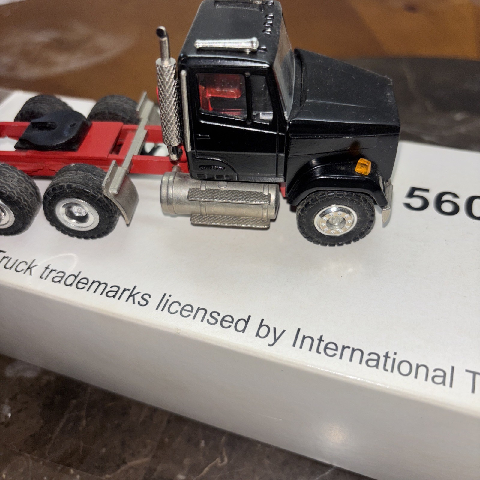 Conrad 1/50, Frightliner With 3 Axle Talbert Lowboy. Used. Black And Red
