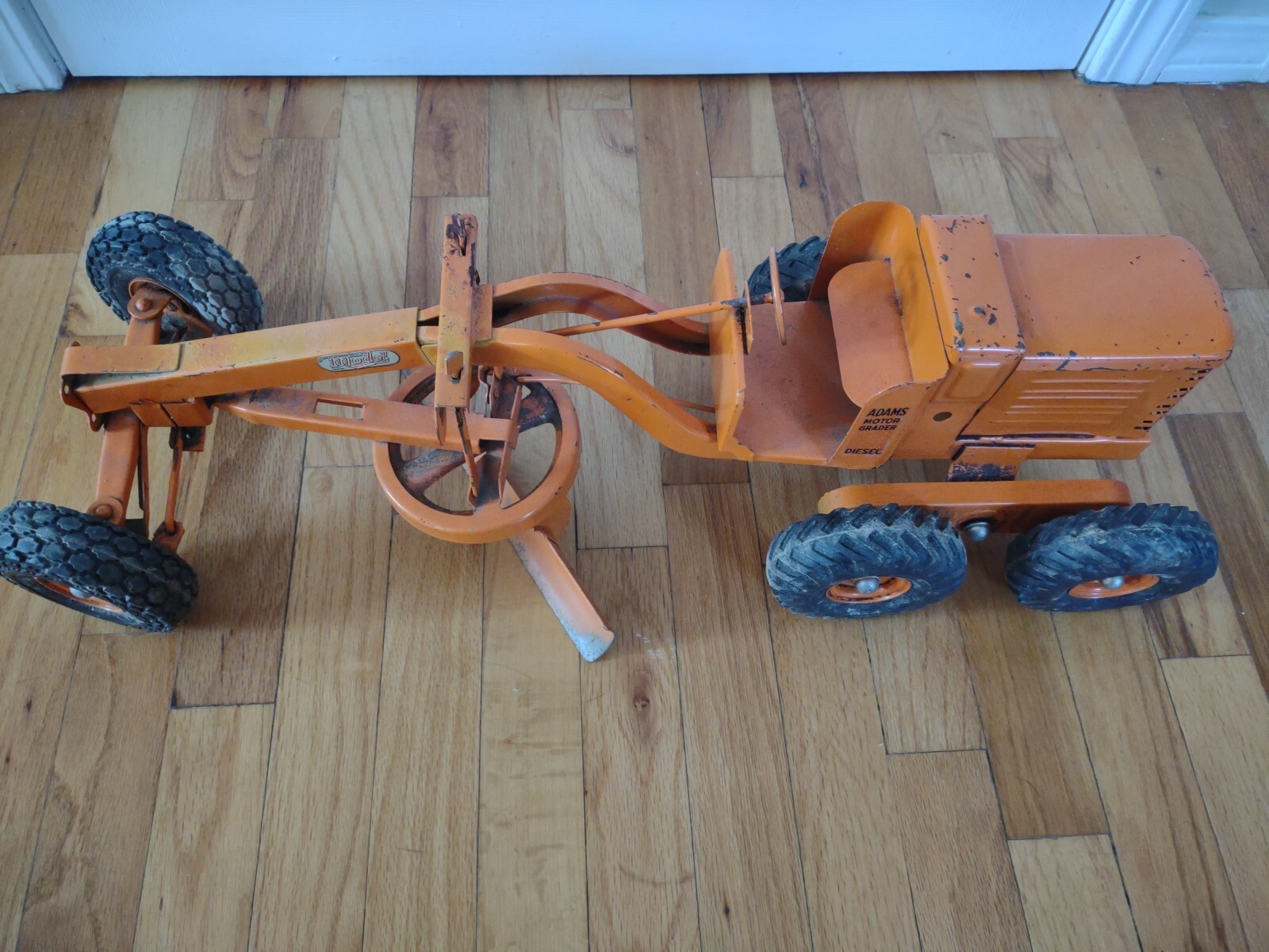 Vintage 1950’s Model Toys Adams Road Grader Diesel motor grader orange Doepke