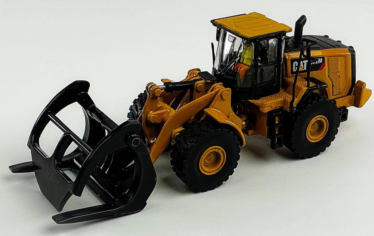 Diecast Masters 85950 Caterpillar 972M Wheel Loader with Log Fork 1/87 Scale