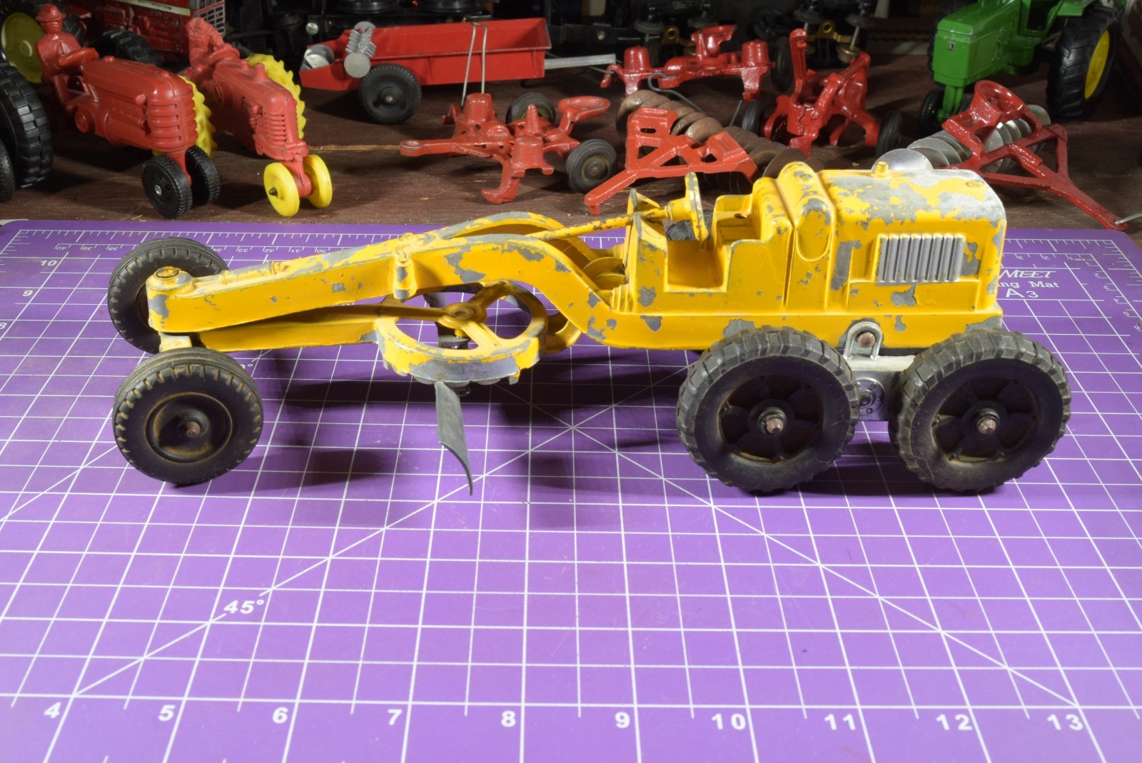 Hubley yellow grader, blade moves but re-engineered at swivel point has issues