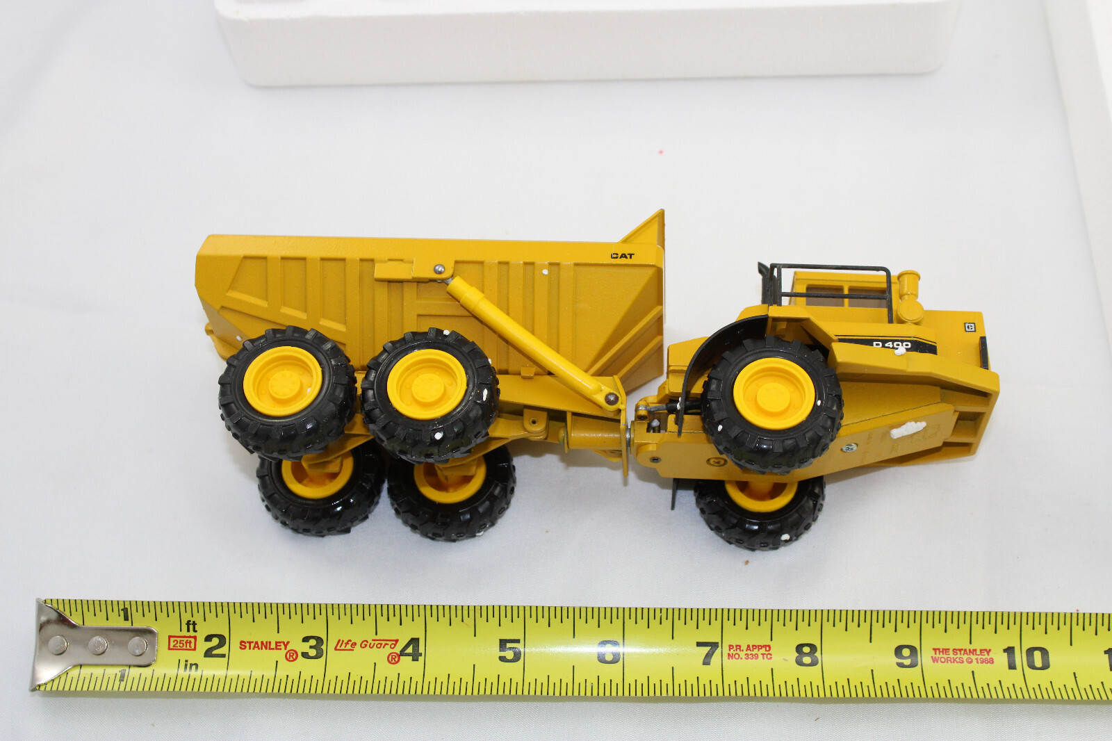 Diecast – Conrad 2862 – CAT D400 – Articulated Dump Truck