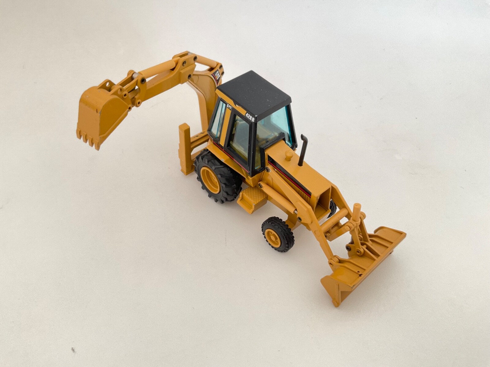 CAT # 2851 NZG No.2851 CAT 428B Backhoe Loader 1/50
