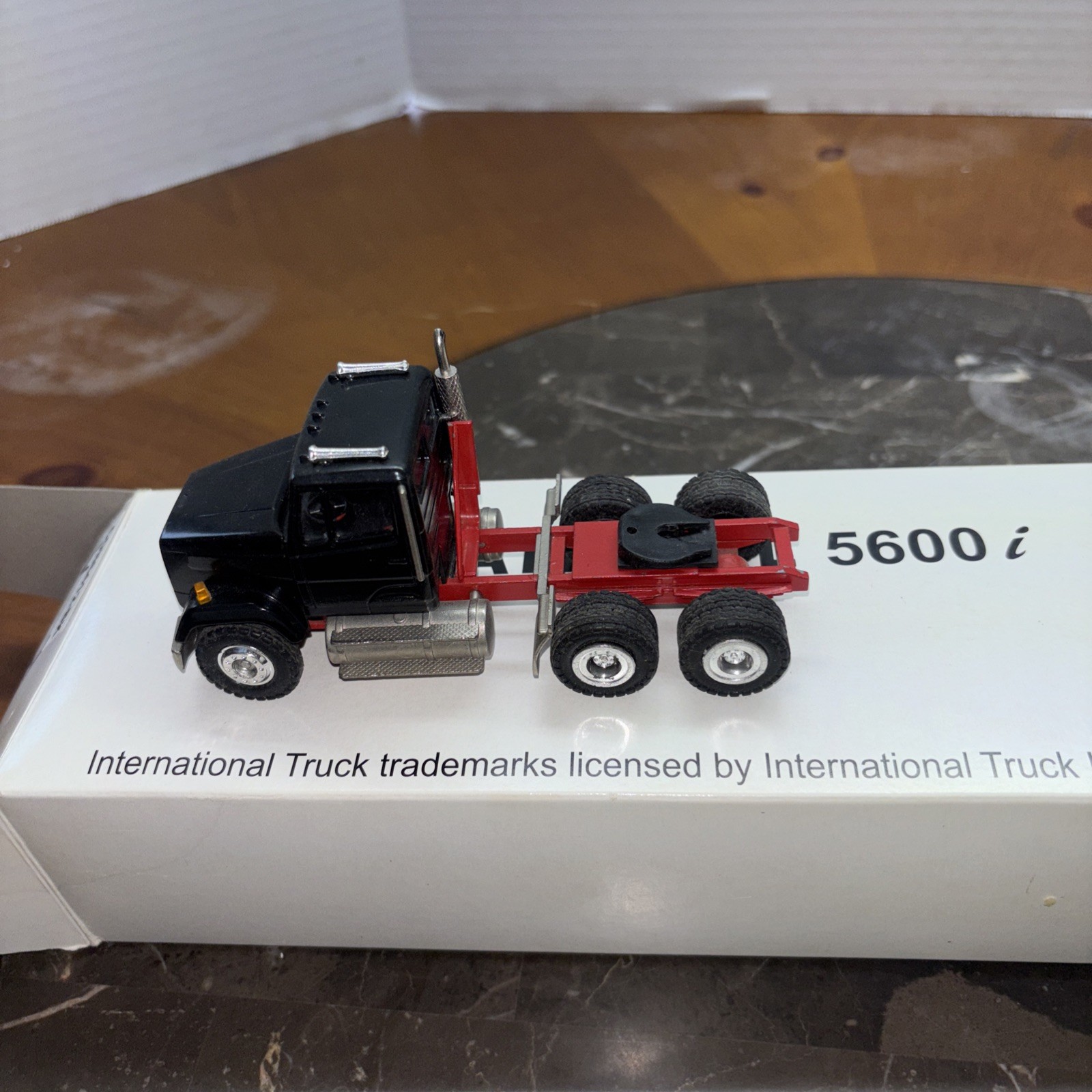 Conrad 1/50, Frightliner With 3 Axle Talbert Lowboy. Used. Black And Red