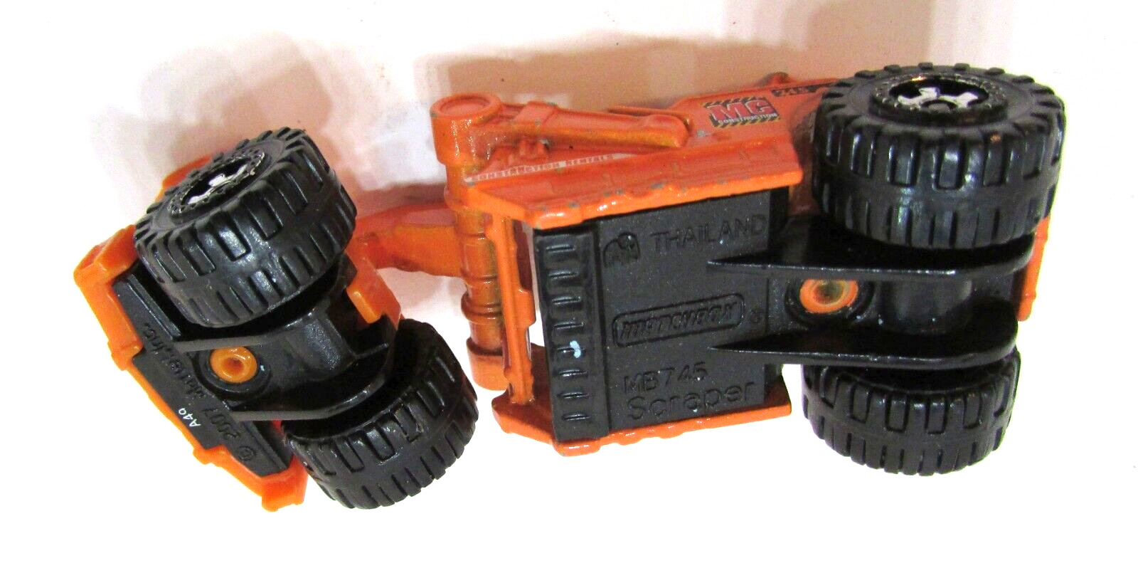 2007 Mattel Matchbox Orange Scraper MC 745 Construction Rentals Diecast Plastic