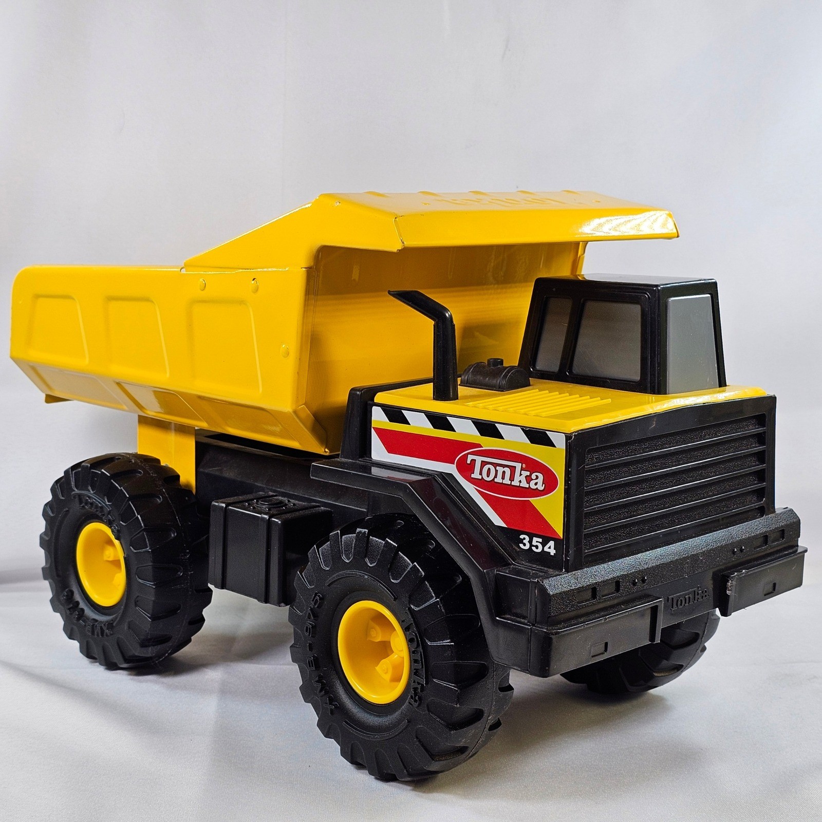 Tonka 354 Mighty Dump Truck Yellow Steel Bed Construction Toy Vehicle 17 Inch
