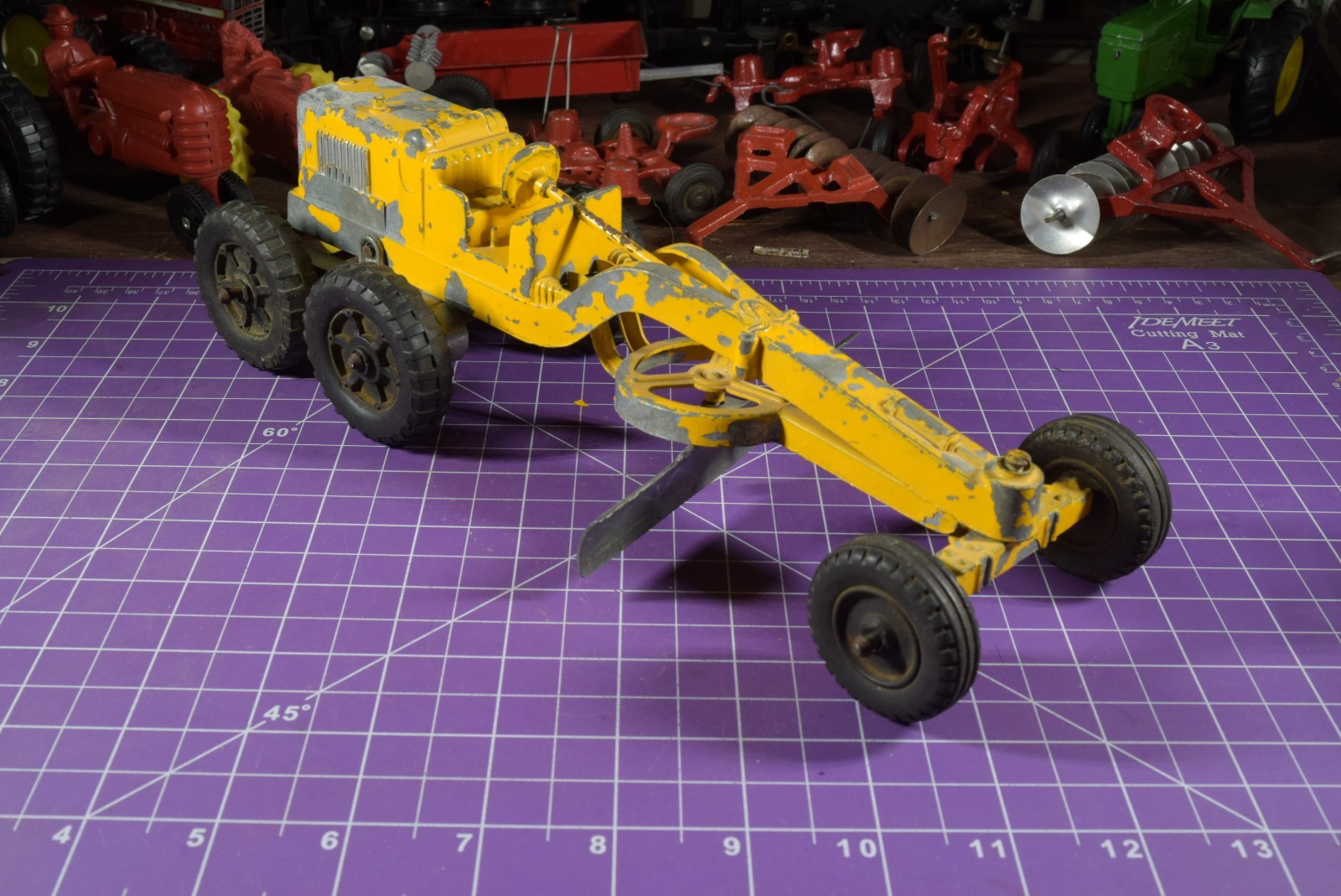 Hubley yellow grader, blade moves but re-engineered at swivel point has issues