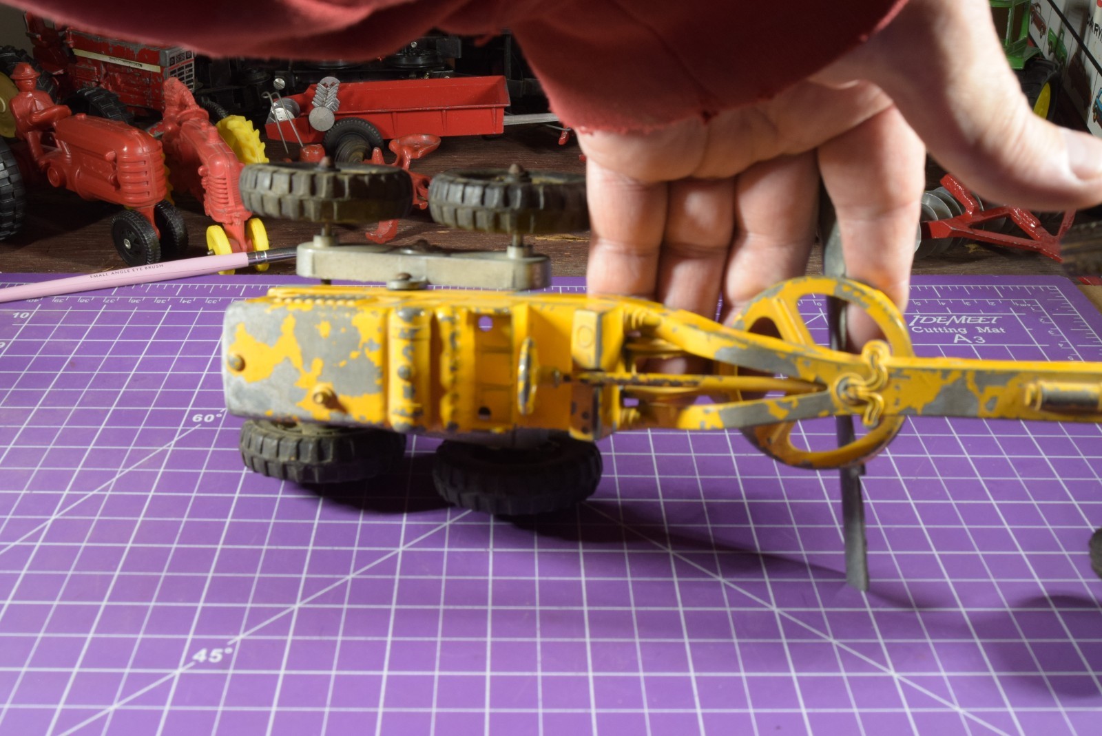 Hubley yellow grader, blade moves but re-engineered at swivel point has issues