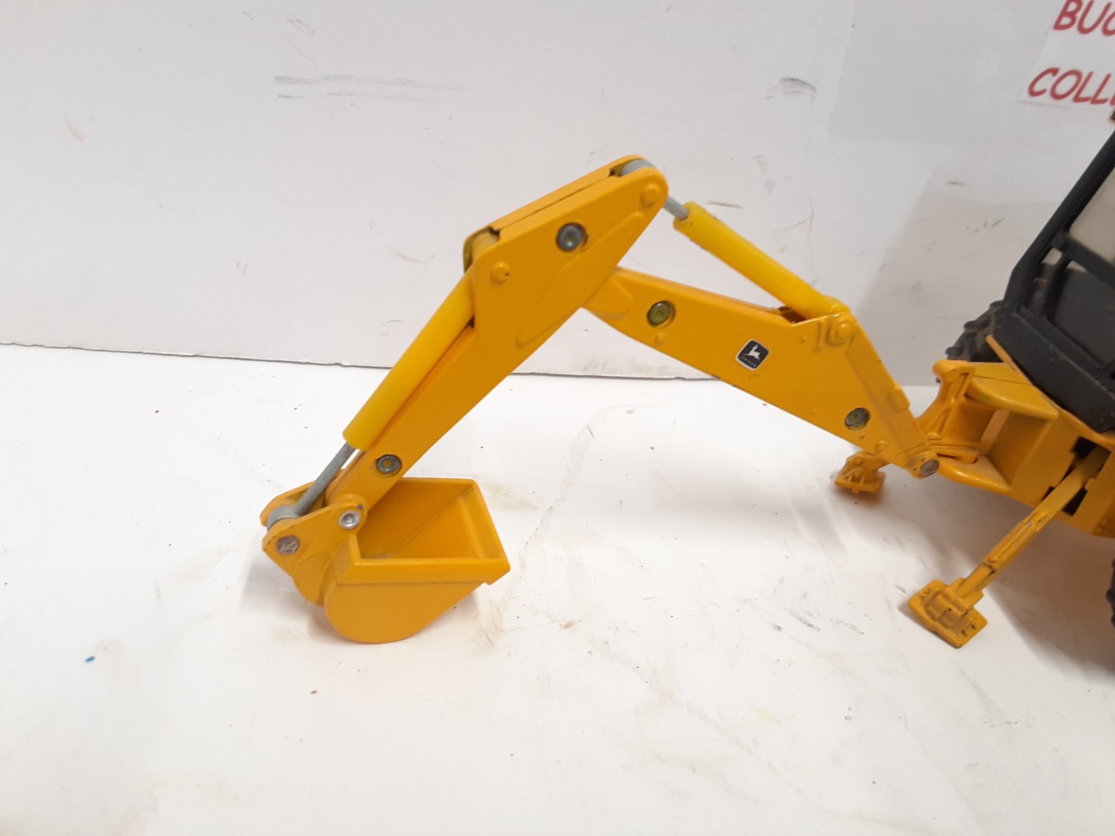 Ertl ~John Deere 310D Backhoe/Loader Yellow, 1:32 Scale No Box