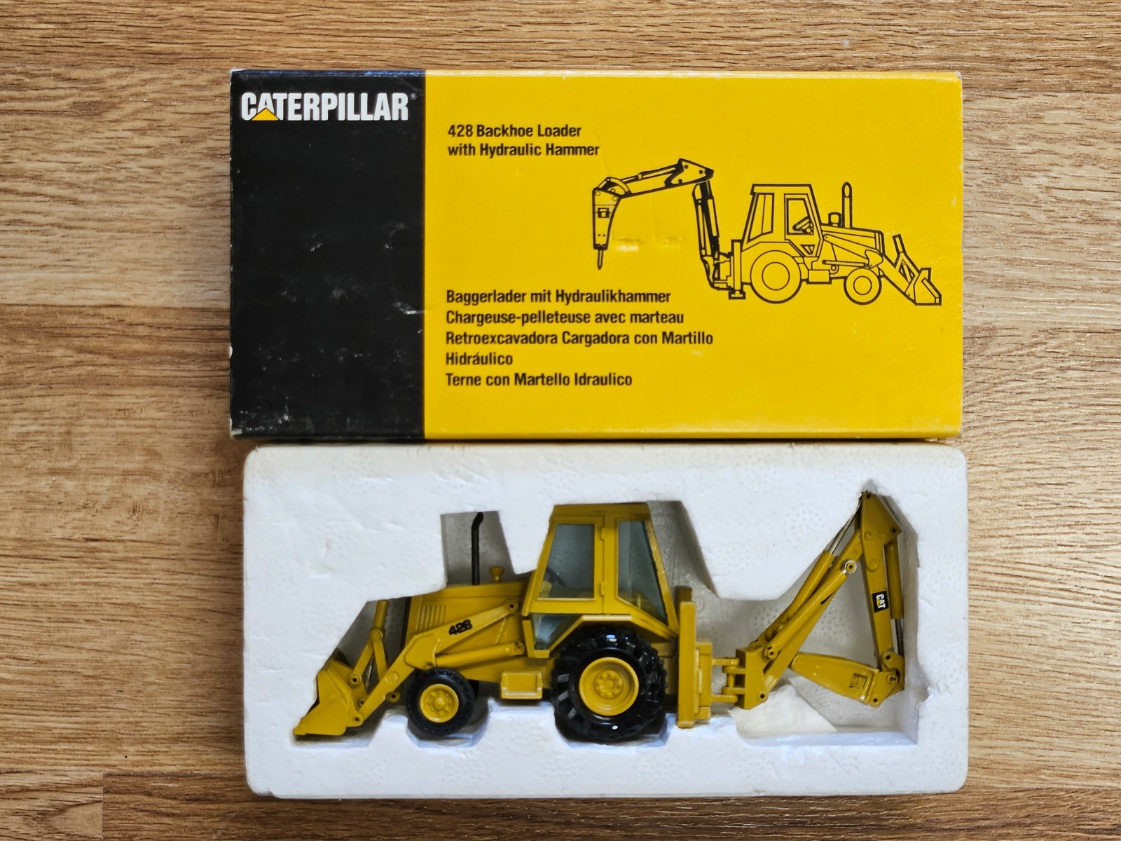 NZG CAT 428 Backhoe Loader