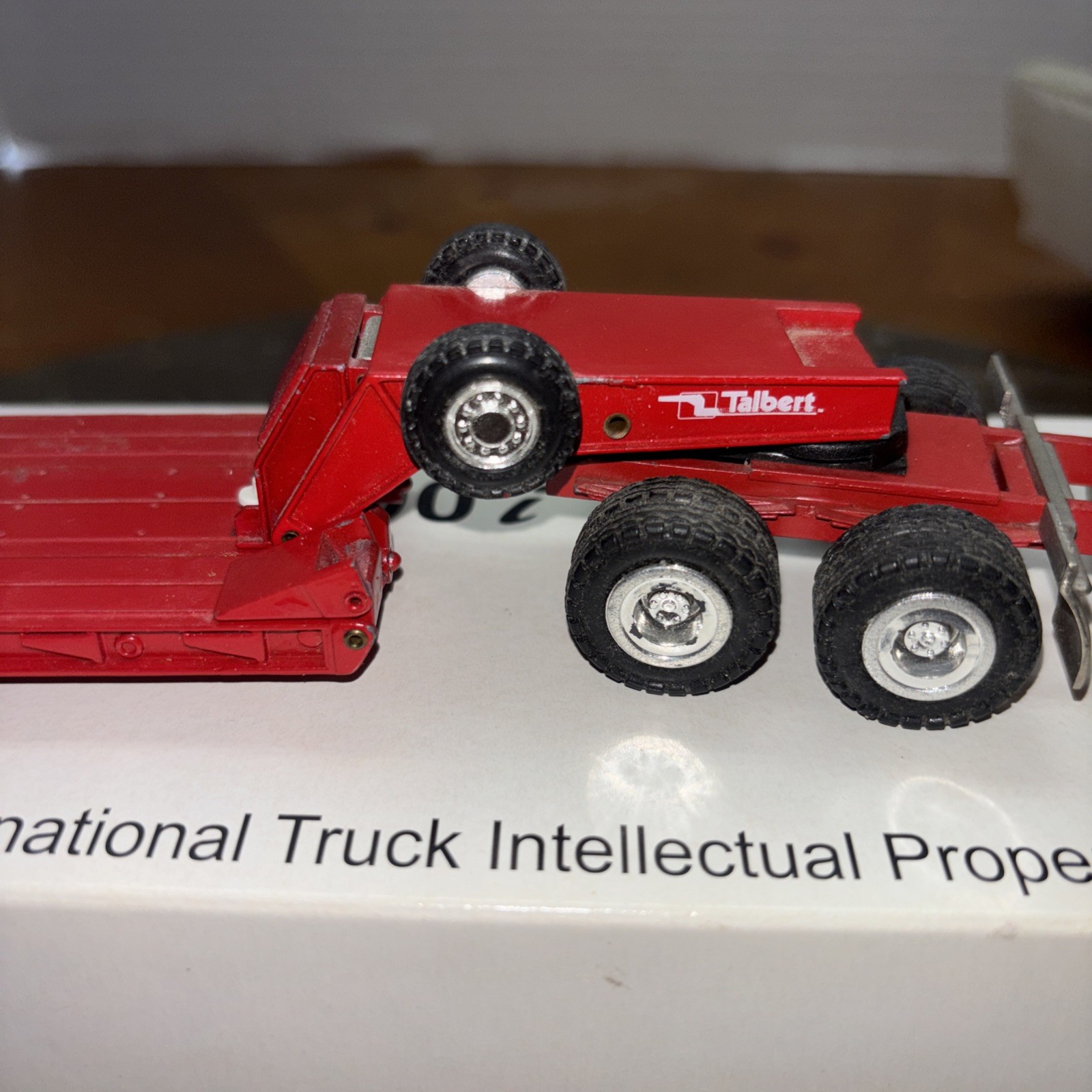 Conrad 1/50, Frightliner With 3 Axle Talbert Lowboy. Used. Black And Red