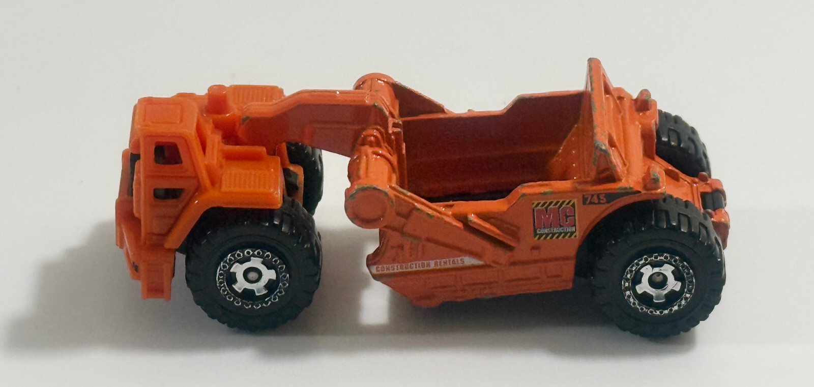 2007 Mattel Matchbox Orange Scraper MC 745 Construction Rentals Diecast Plastic