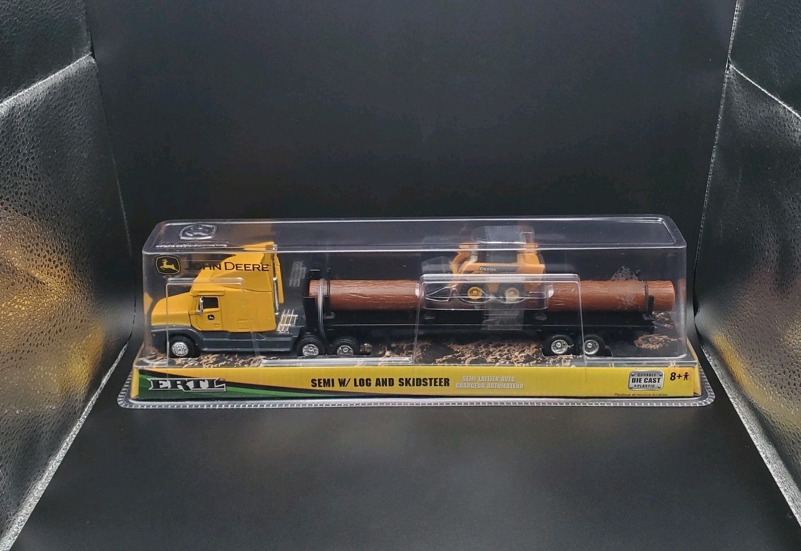 JOHN DEERE – ERTL SEMI W/ LOG AND SKIDSTEER 37382