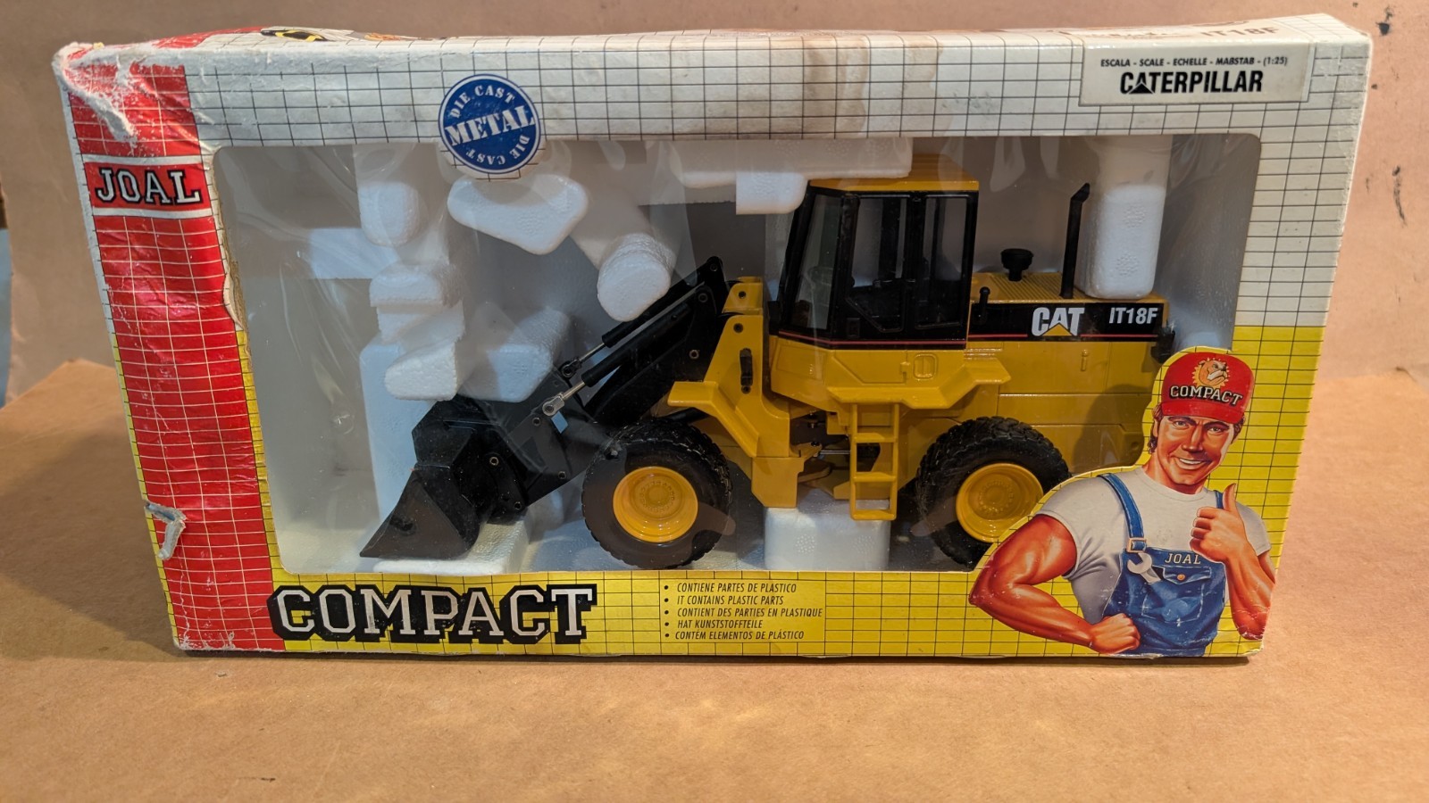 Joal Compact 1:25 scale Caterpillar Loader IT18F new in box. Box damaged