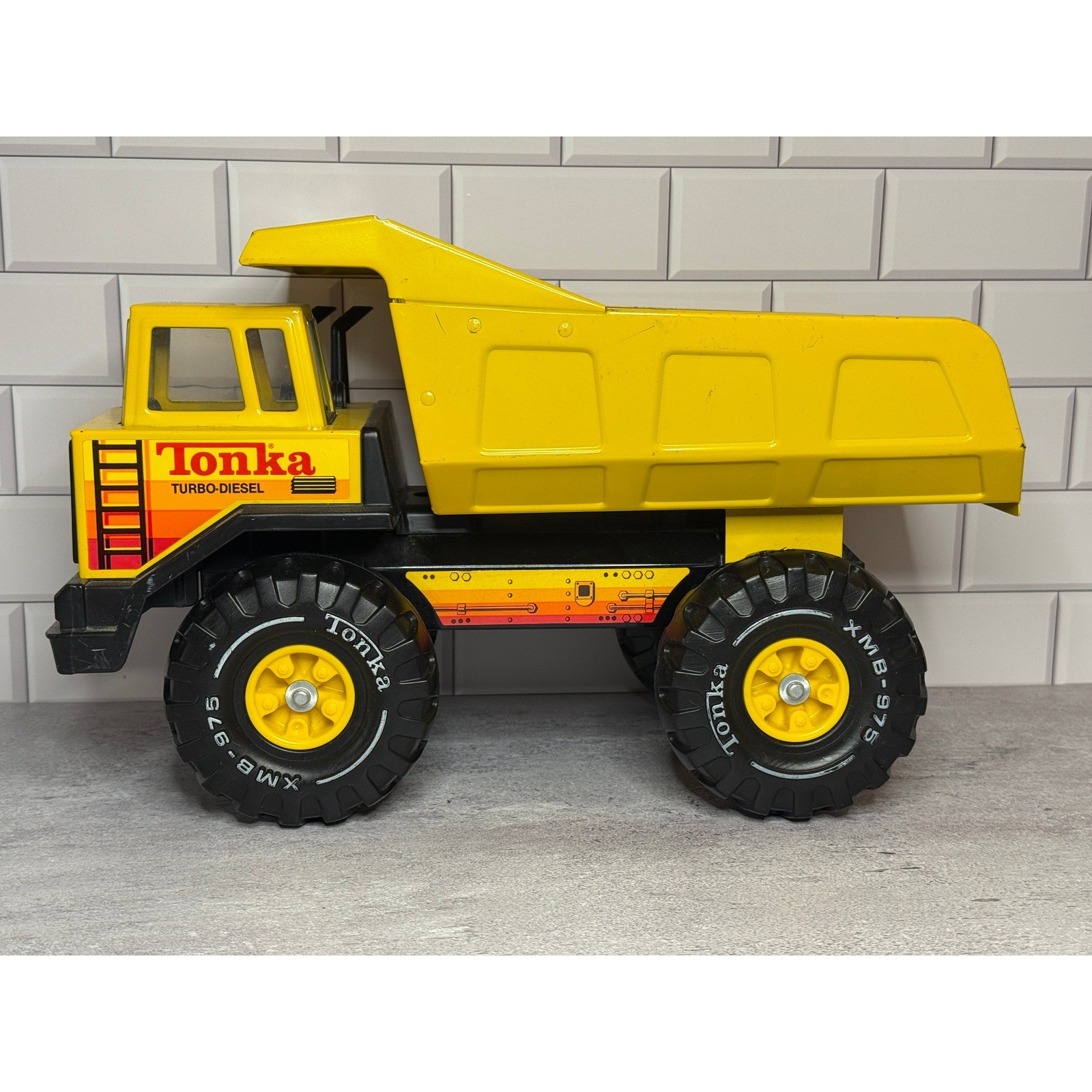 Vintage 1980s Tonka Turbo-Diesel Pressed Steel Dump Truck Yellow XMB-975 Tires