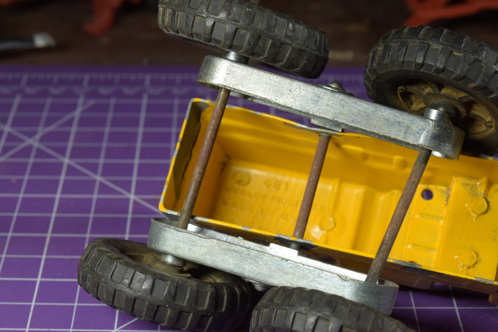 Hubley yellow grader, blade moves but re-engineered at swivel point has issues