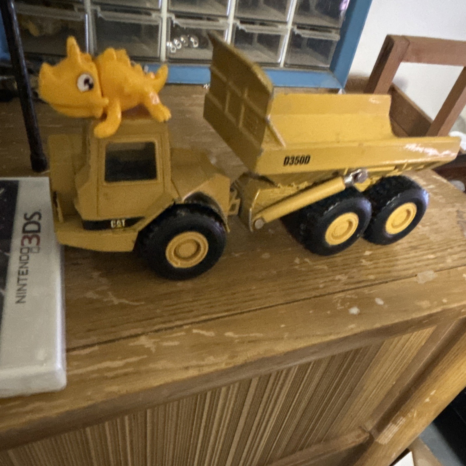 Ertl CAT D350D Yellow Dump Truck Diecast Model 249SF with lil dino fella
