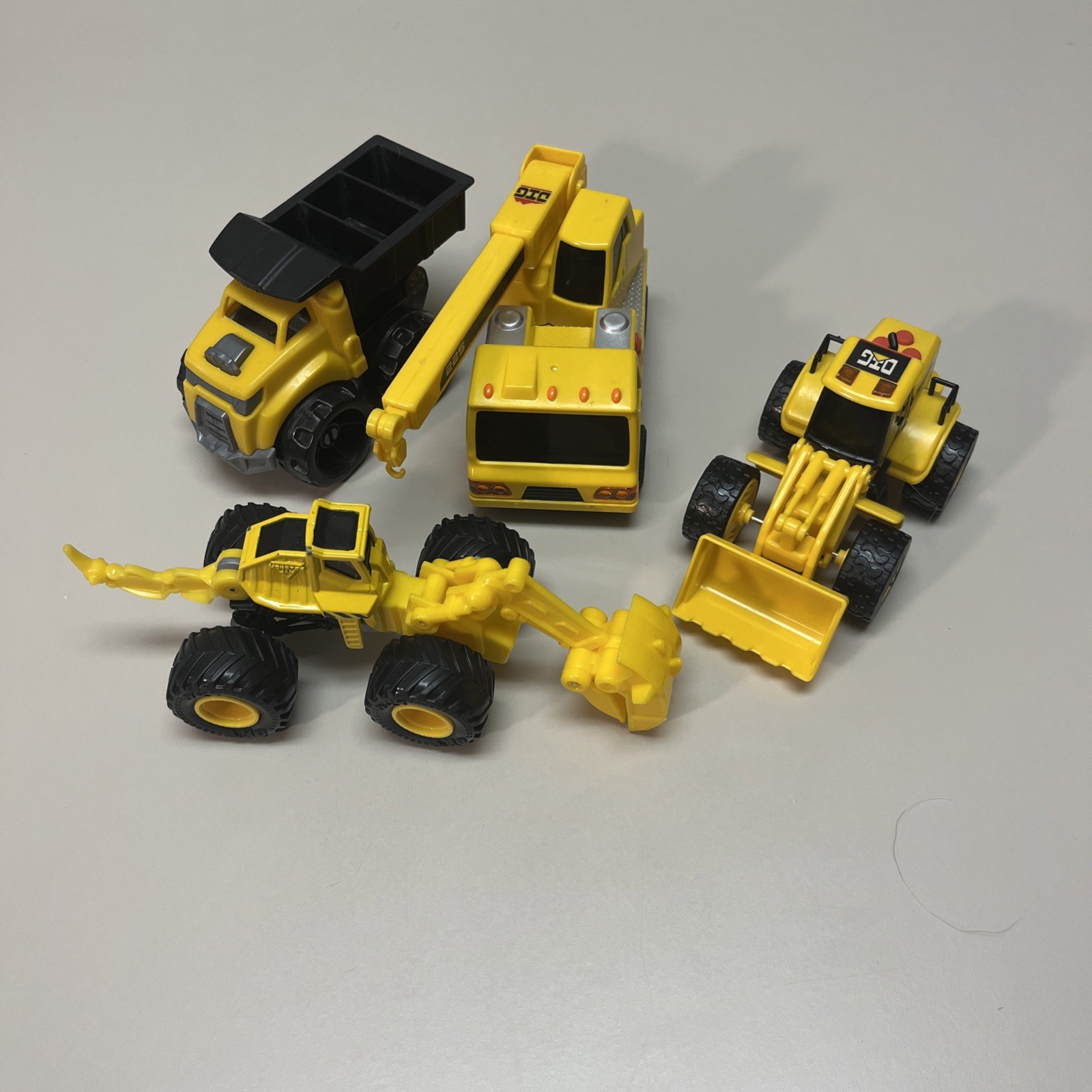 Plastic Set Of 4 Construction Variety Trucks W/ 1 Dino Digger! Christmas Gifts