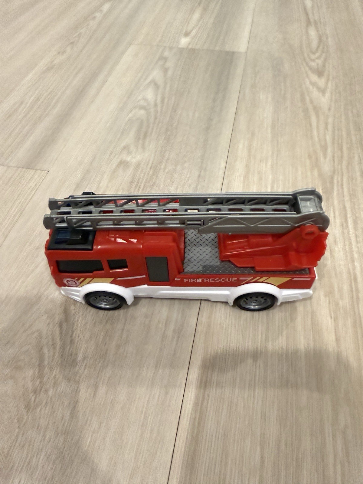 Lot of 3 vehicles: fire truck, ambulance, and dump truck.