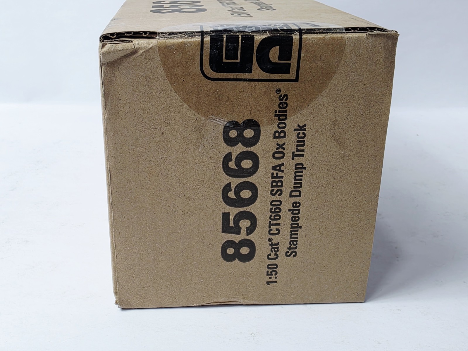 DIECAST MASTERS 85668 CAT SBFA OX BODY STAMPEDE DUMP TRUCK NEW IN BOX VERY NICE!