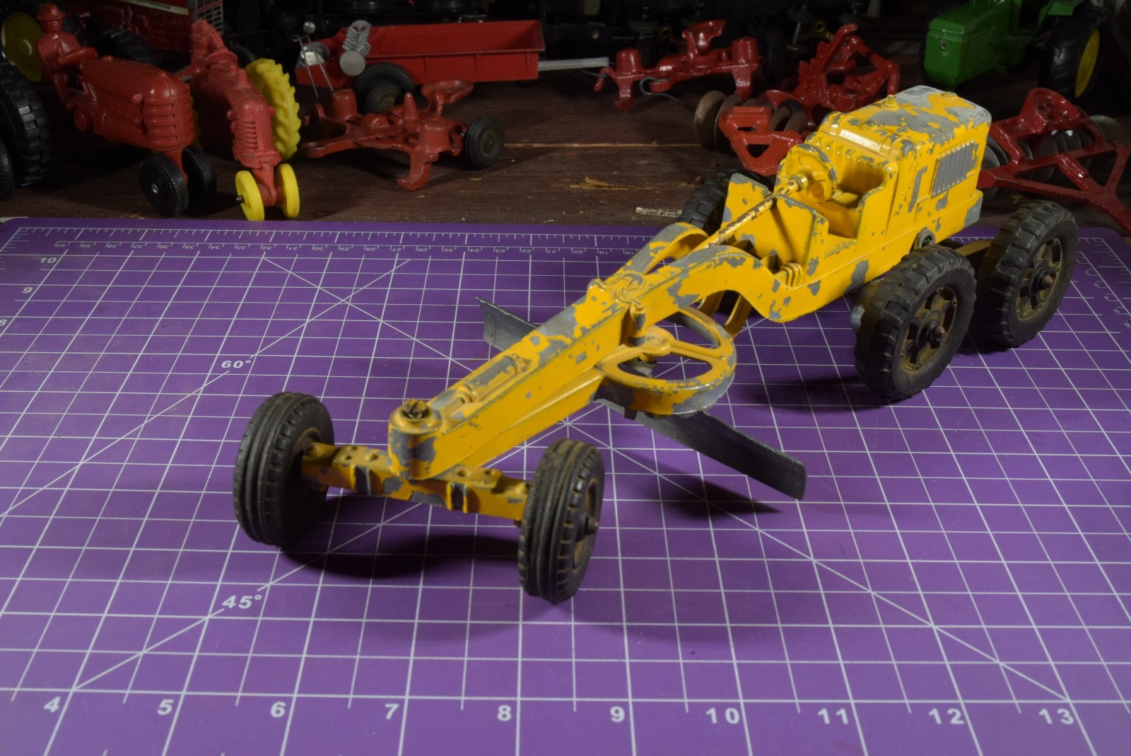Hubley yellow grader, blade moves but re-engineered at swivel point has issues