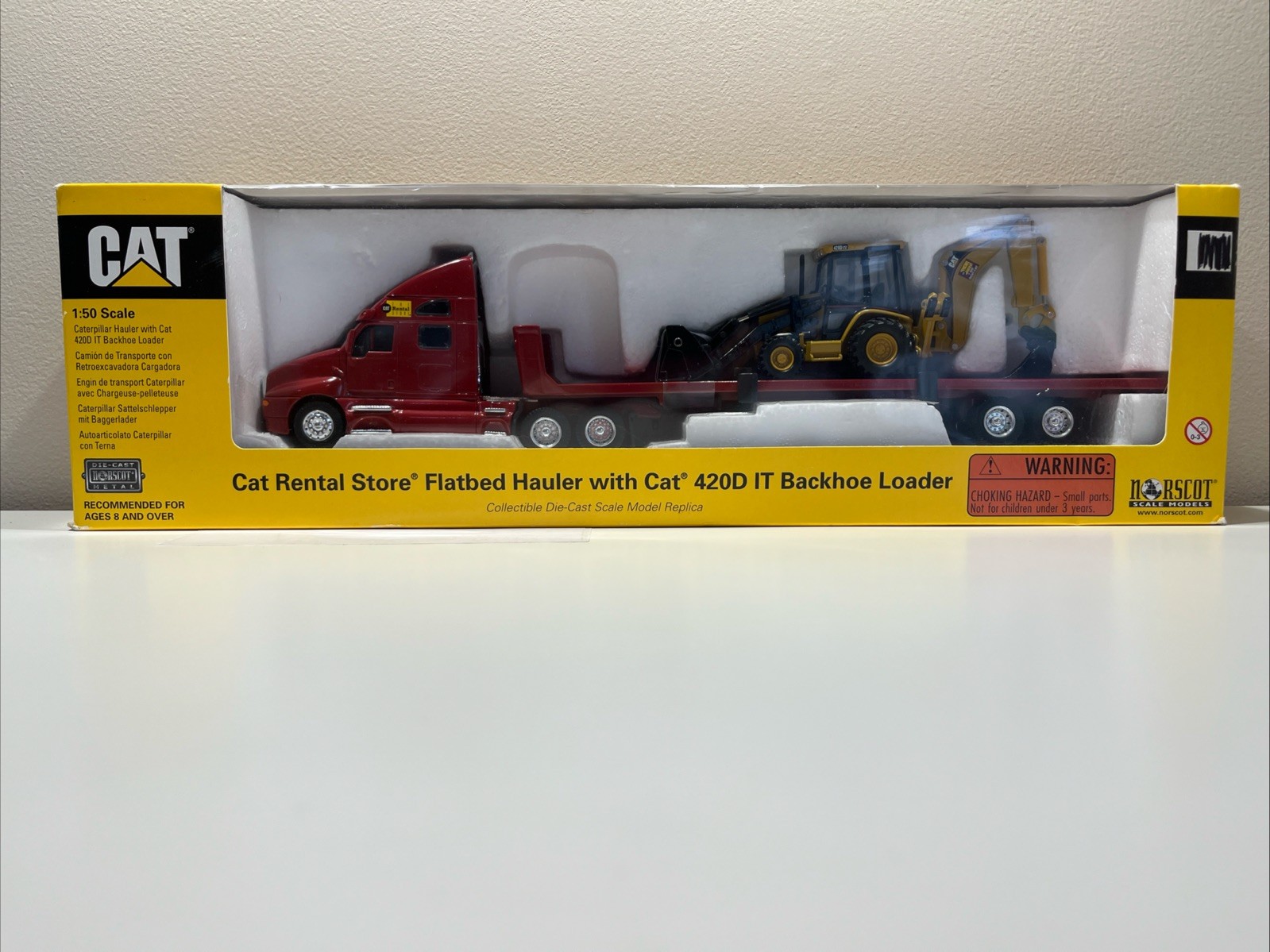 NORSCOT CAT RENTAL STORE FLATBED HAULER WITH 420D IT BACKHOE LOADER DIECAST 1:50