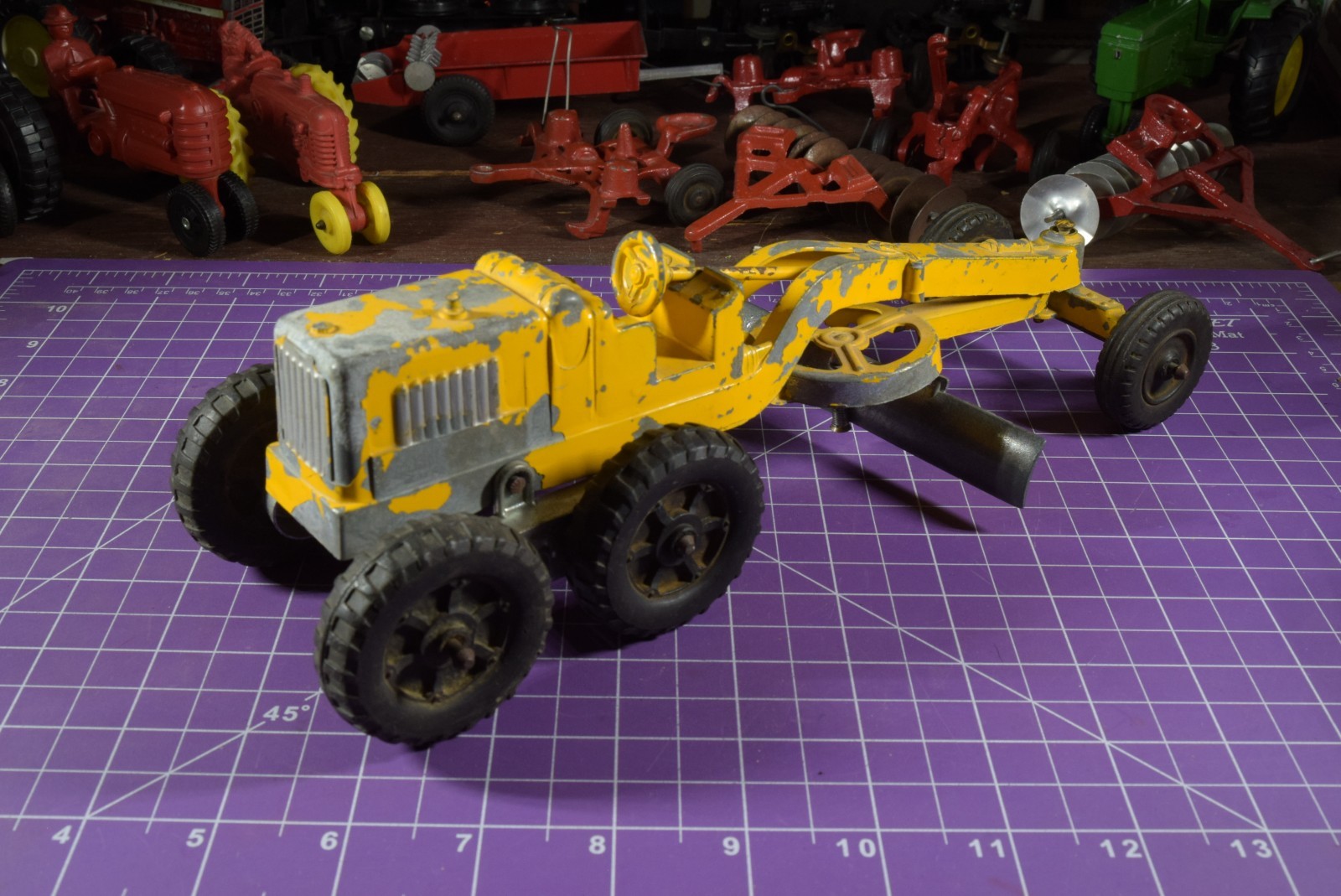 Hubley yellow grader, blade moves but re-engineered at swivel point has issues