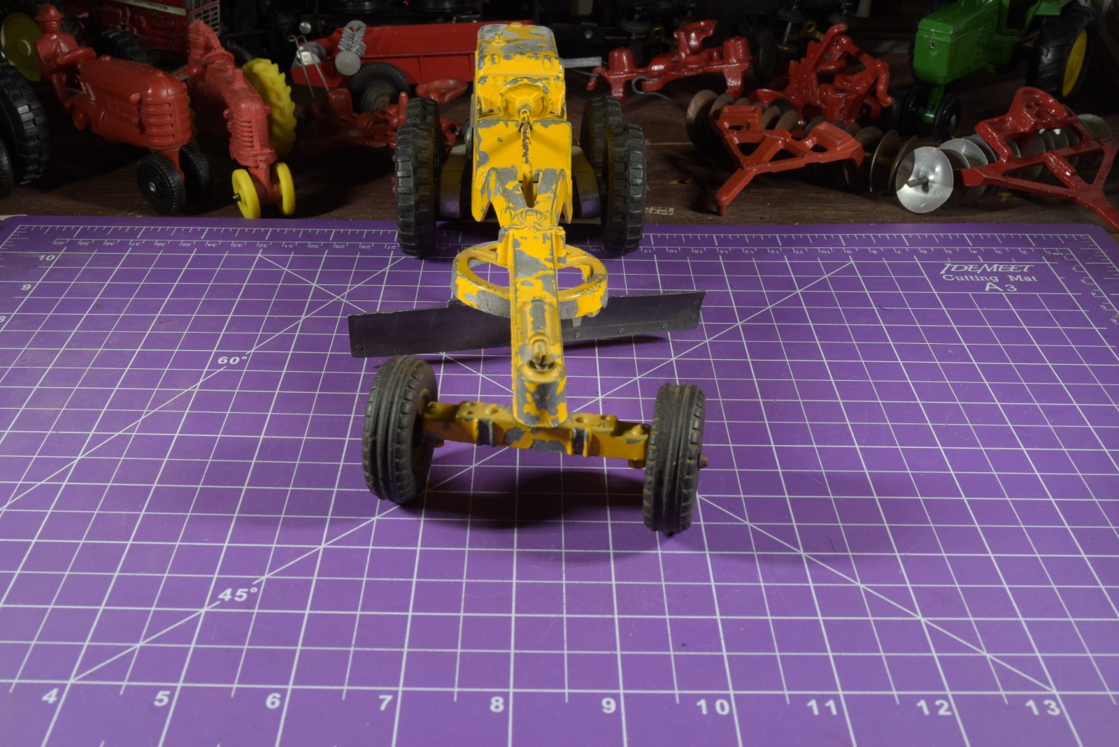 Hubley yellow grader, blade moves but re-engineered at swivel point has issues