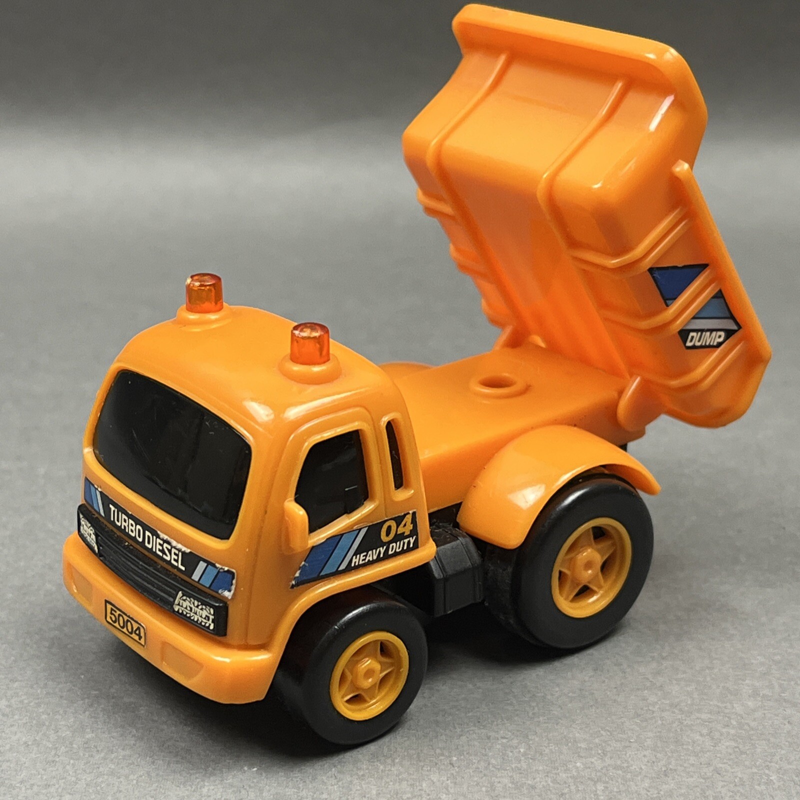 3” Mini Orange Dump Truck “Heavy Duty Turbo Diesel” Assisted Movement E BO Toys
