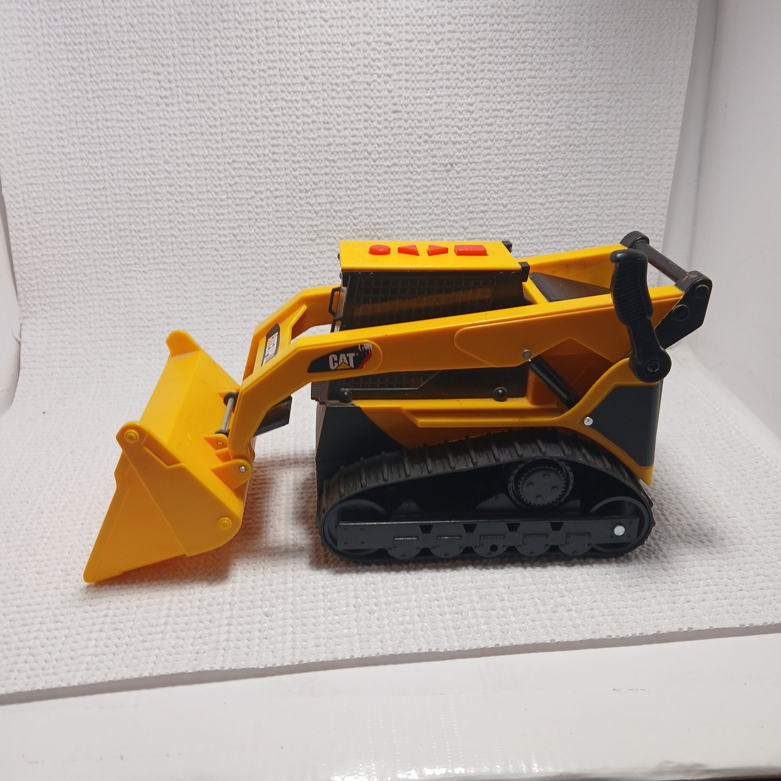 Caterpillar (CAT) toy skid steer loader, likely a “Big Builder”. UNTESTED
