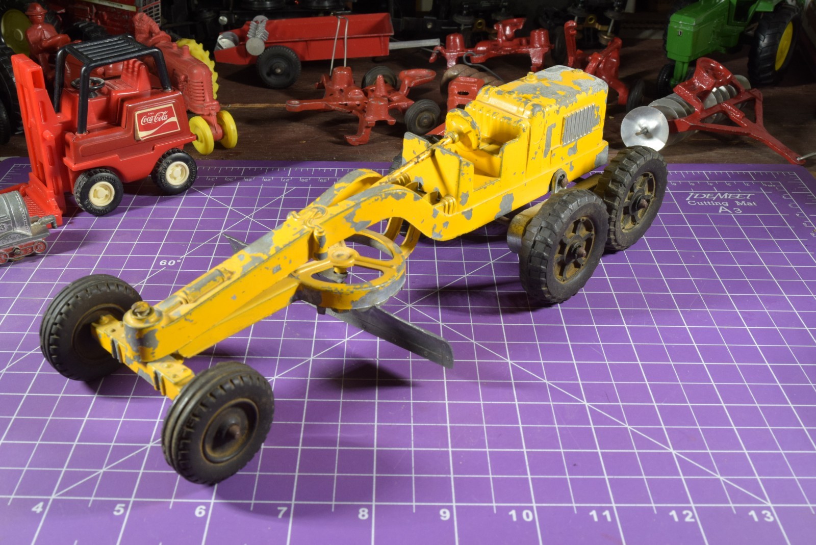 Hubley yellow grader, blade moves but re-engineered at swivel point has issues