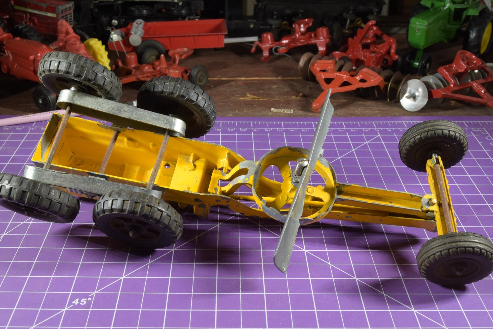 Hubley yellow grader, blade moves but re-engineered at swivel point has issues