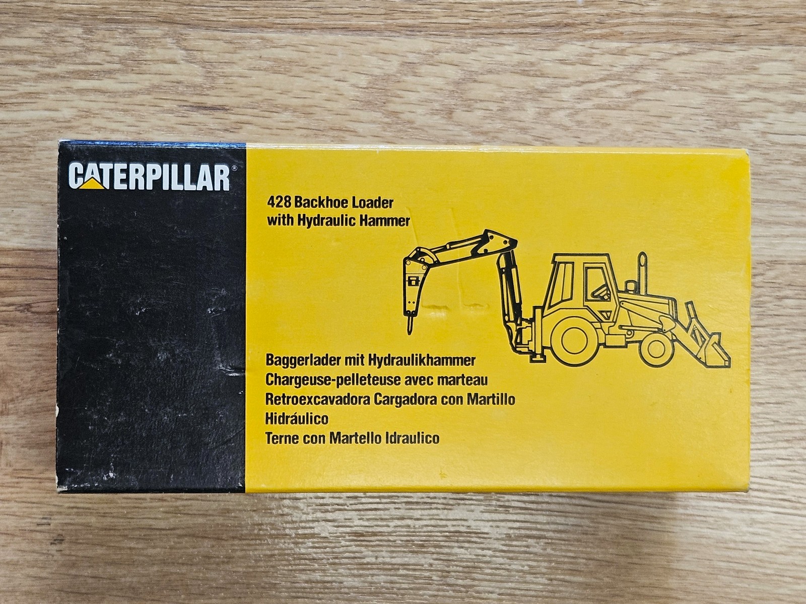 NZG CAT 428 Backhoe Loader