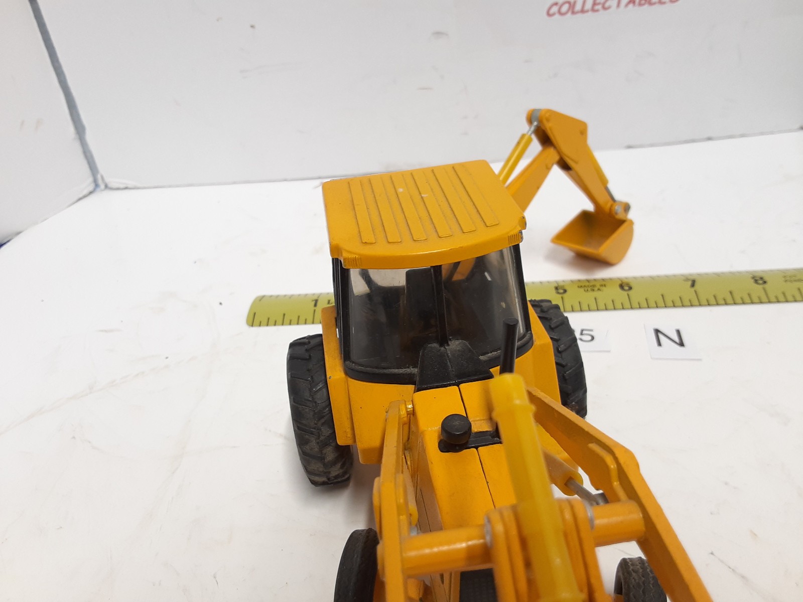 Ertl ~John Deere 310D Backhoe/Loader Yellow, 1:32 Scale No Box