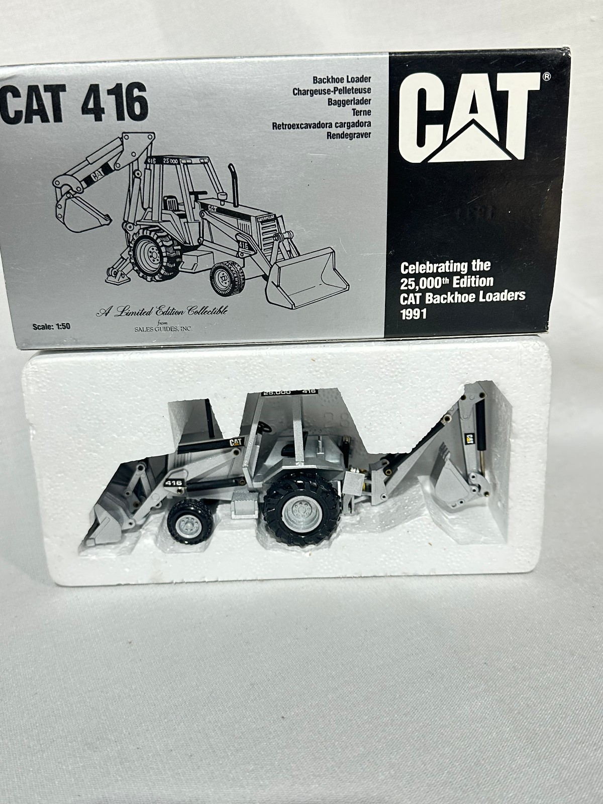 Caterpillar 416 Backhoe Loader 25,000th Silver Edition By NZG 1/50th Scale